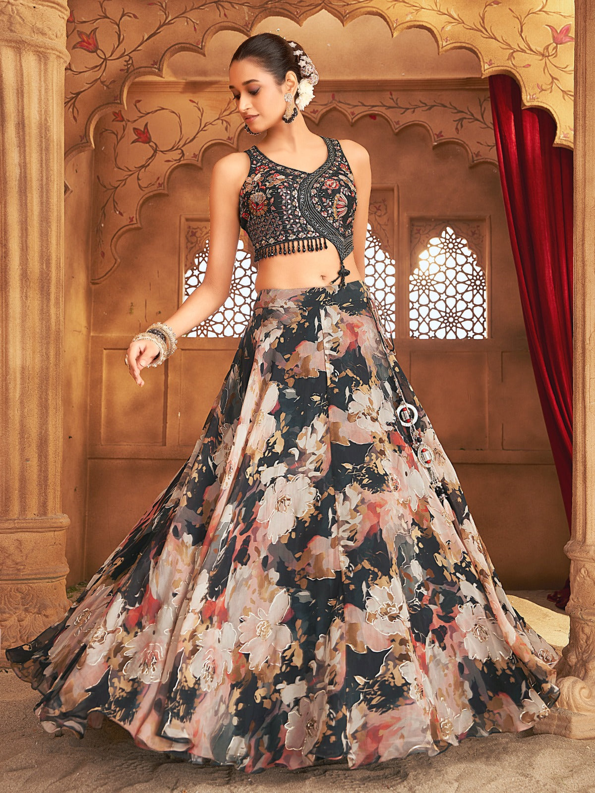 Black floral Sherni London lehenga with gold embroidery and asymmetrical blouse