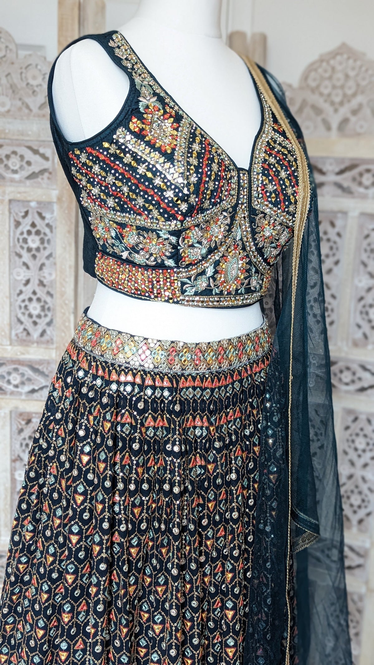 Sherni London Teal Lehenga georgette with net dupatta and heavy multi coloured embroidery all over