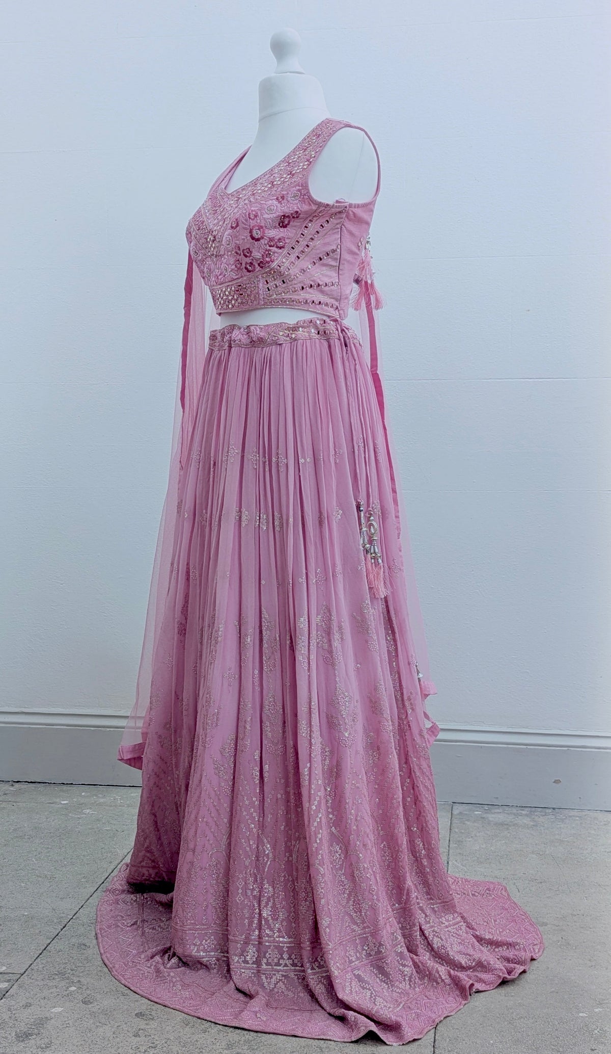 Pink ombre lehenga with delicate gold embroidery in soft georgette with a net dupatta